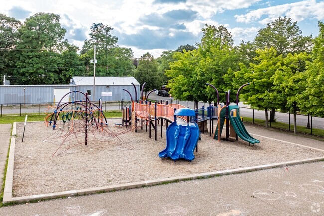 A large playground is located behind the school