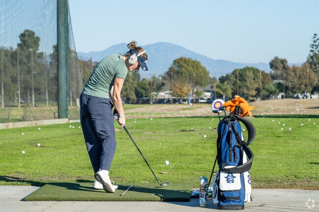 The Costa Mesa Country Club offers a mountain view at their driving range.