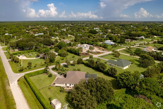 Aerial view of traditional & new construction in the Palm Beach Country Estates neighborhood.