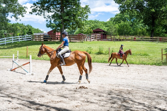 Capture the delight of two young girls horseback riding at Faith Hill Farm in Shippeetown, RI.