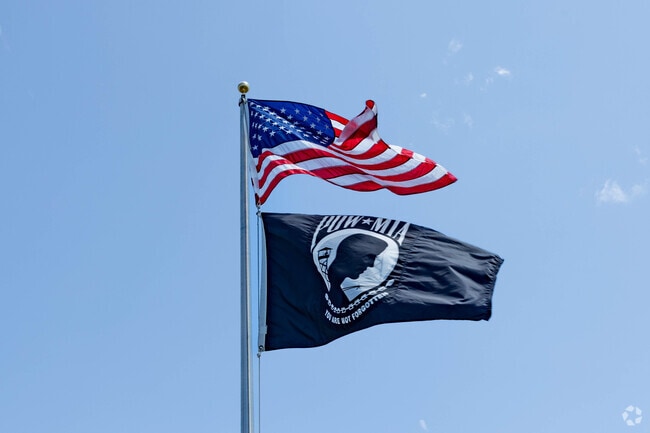 American flags and POW flags can be seen waving in the wind all over Island Park, NY.