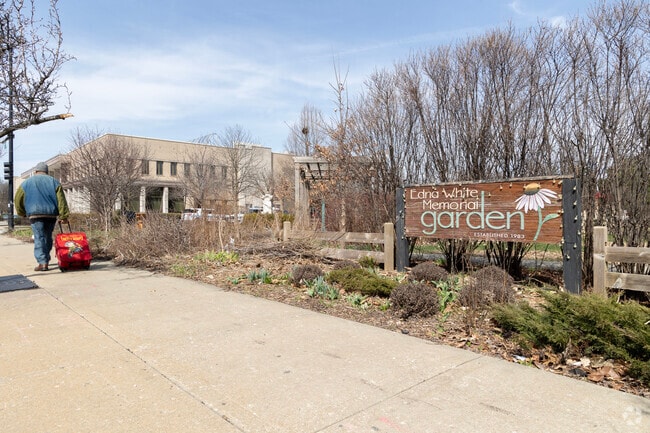 Morgan Park residents stroll past the Edna White Memorial Garden.
