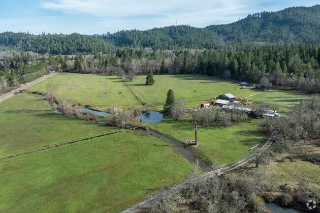 Farm houses with horses and land are common in Takilma.