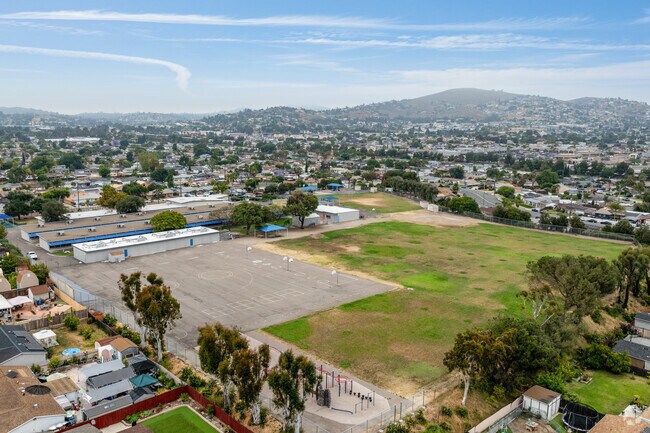 An elevated view shows the campus and playing fields at Rancho Elementary School in La Presa.
