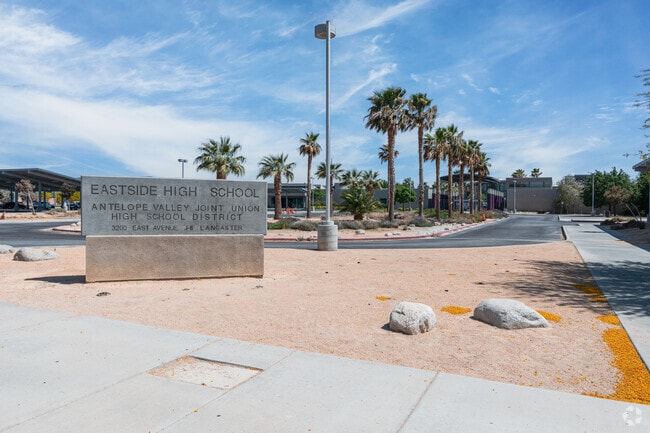 There is a large entrance sign in front of Eastside High School.