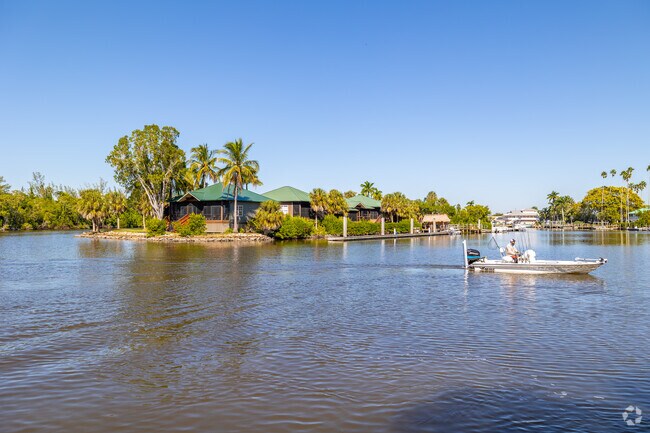 Boats cruise along rivers near Everglades City and Big Cypress Preserve.
