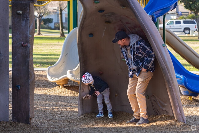 A Bakersfield father plays hide and seek with his son at their local park.