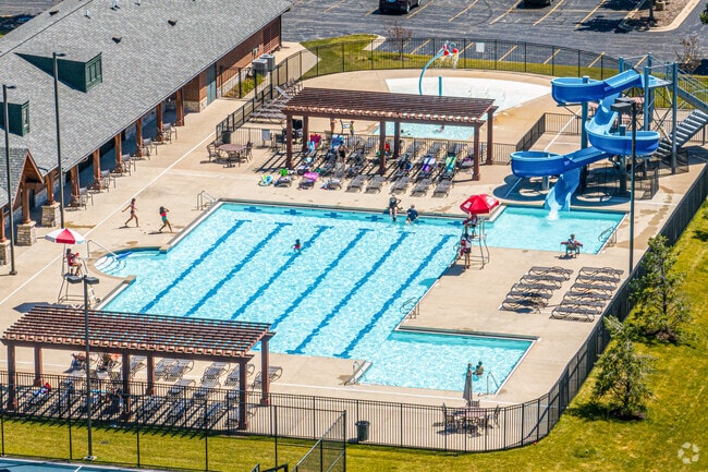 Families enjoying the swimming pool at the Ashwood Club.