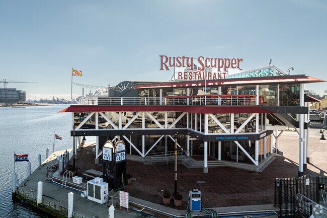 The Rusty Scupper sits on the water in the Inner Harbor, with a fueling station for boats.