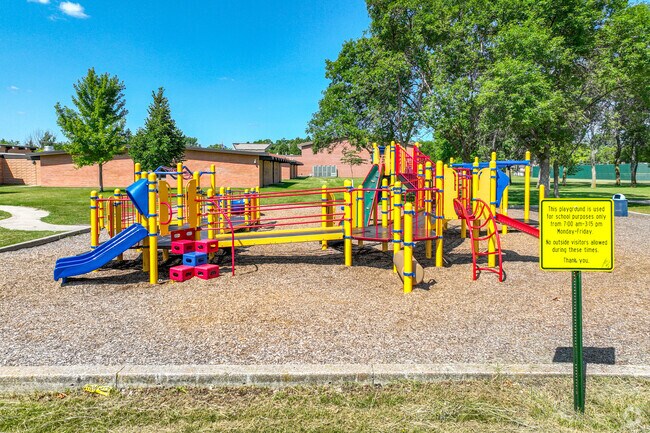 Your children will love playing on the playground at Longfellow Park.