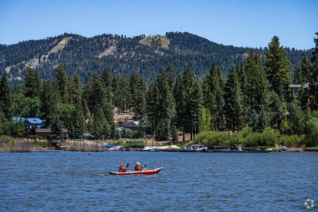 Kayakers glide along Big Bear Lake, enjoying the countryside.