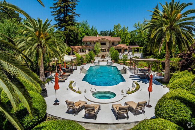 Numerous wineries in Saint Helena offer wine tasting by pools and palm trees.