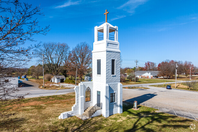 A 73-year old bell tower stands next to the St. Joseph Catholic Church reflecting its history.