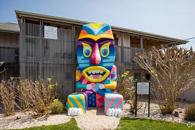 Pose in front of the Moai statue by Greg Mike at the Montauk Beach House.
