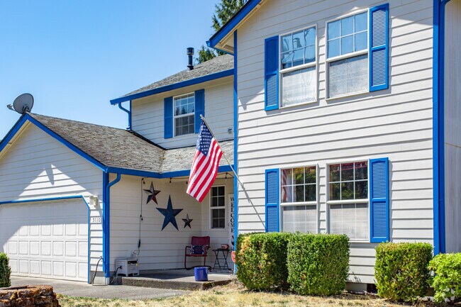 Burnt Bridge Creek homeowners showcase colorful homes with well-kept properties.