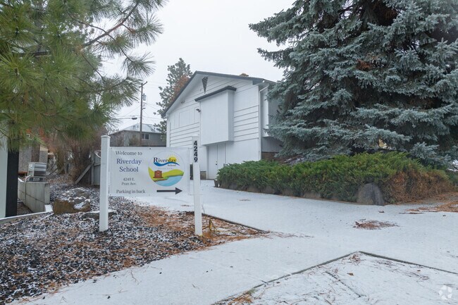 Riverday school features a small parking lot in front of the school.