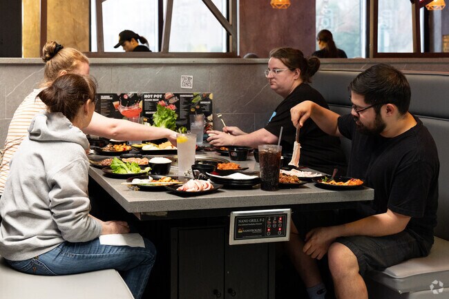 Catching a bite at the vibrant KPot Korean Barbecue scene in Hunter Hills.