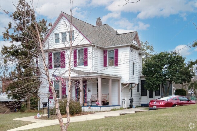 Colonial style homes feature long driveways and walkways in Berwyn Heights, MD.