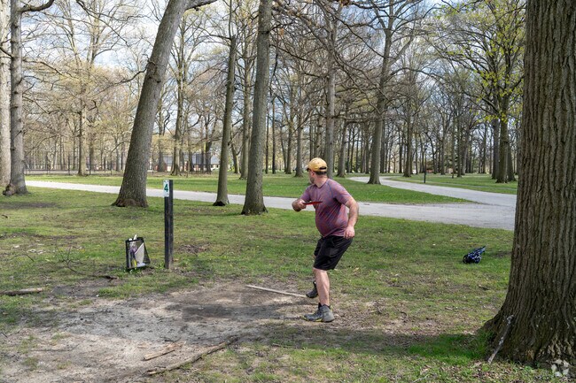 Disc Golfer at Wick Park tees off.