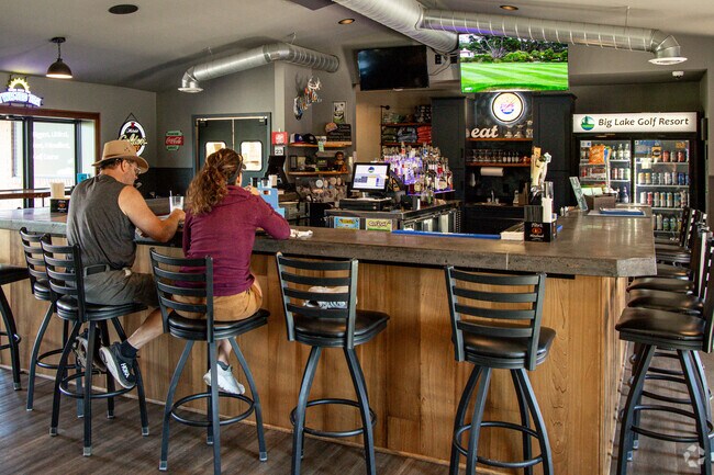 Locals can grab a bite to eat or a drink at the Big Lake Golf Resort.