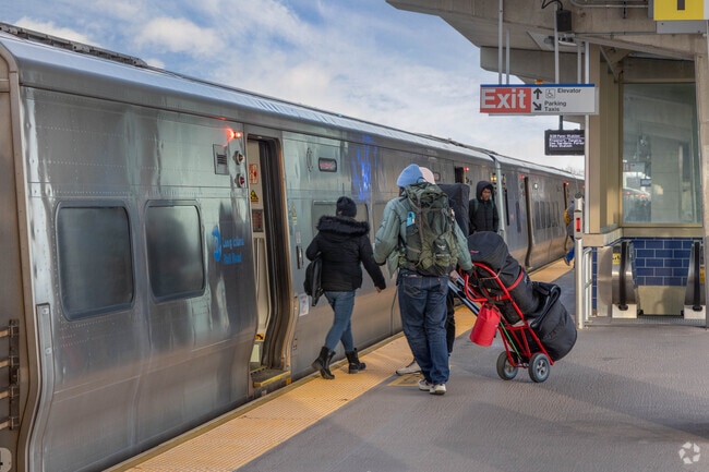 The LIRR Bellmore station is elevated and has two tracks on either side of the platform.