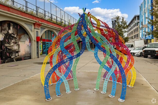 Colorful art installations are visible just outside the commuter rail station in Downtown Lynn.