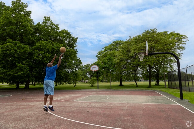 Residents enjoy use of the basketball courts at Garfield Park.