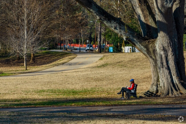 Sit under a tall shady tree at Woodward Way Greenspace.
