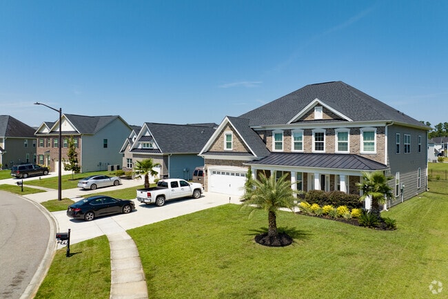 Many homes in Godley Station feature front porches and attached garages.