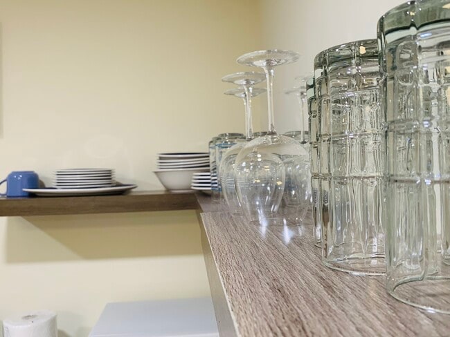 The thoughtfully-designed kitchen comes with plentiful cabinet space and contemporary appliances, ma