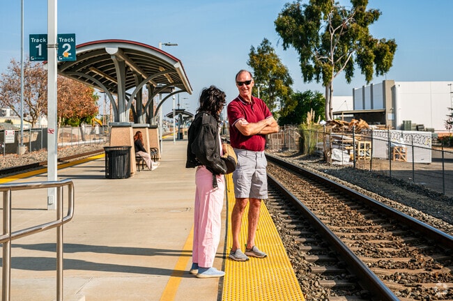 Locals gather at North Pomona Metrolink Station in Pomona Valley to greet arriving loved ones.