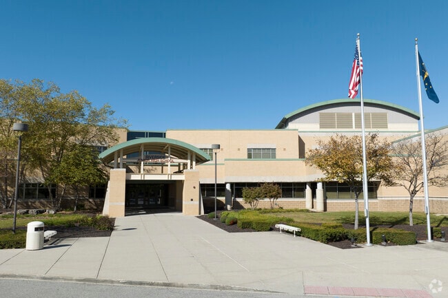 The U.S. and Indiana state flag fly over Riverside Junior High School.