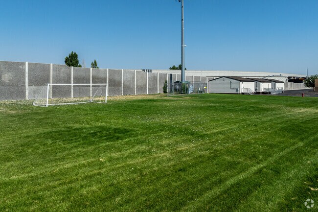 A soccer goal sits on velvety grass at Columbia Elementary School.