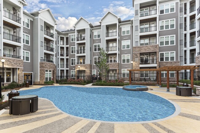 Resort-Style Swimming Pool With Expansive Tanning Areas