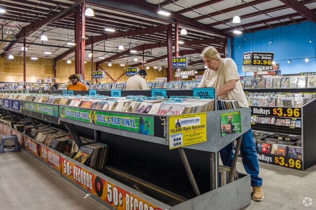 Browse for a classic vinyl LP record at Mad Monk in the Bullard area of Fresno.