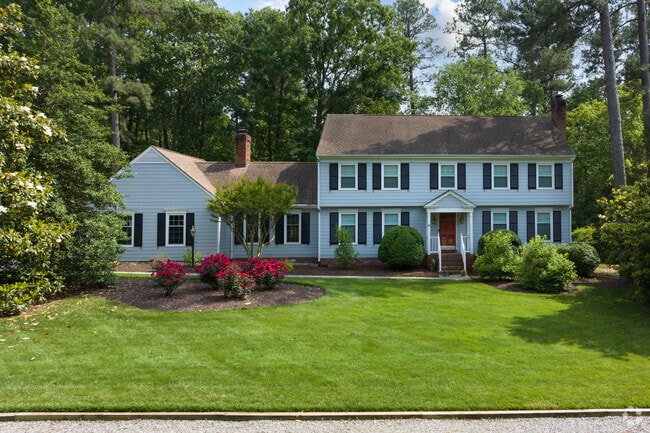 Gayton gorgeous home with manicured lawn.