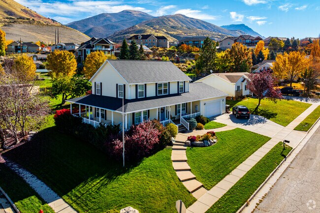A spacious Perry home blends classic design with colorful autumn scenery.