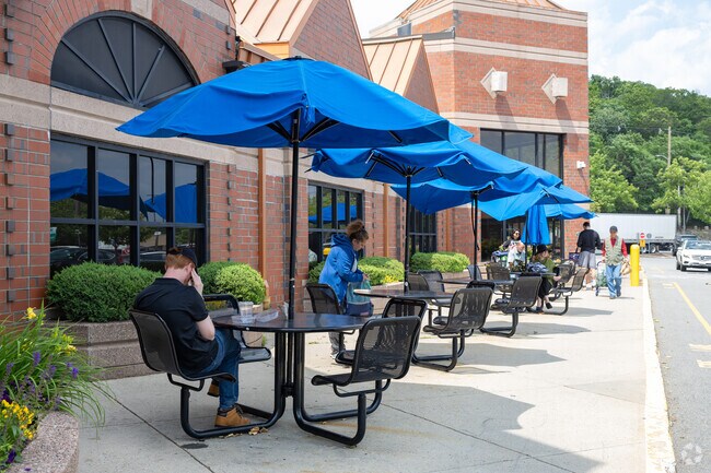 Snag a table at Star Market to enjoy your lunch, a stones throw from the Cushing Square neighborhood.