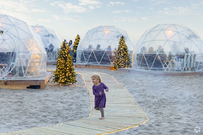 Dine inside cozy igloos near Skating by the Sea at Hotel del Coronado.