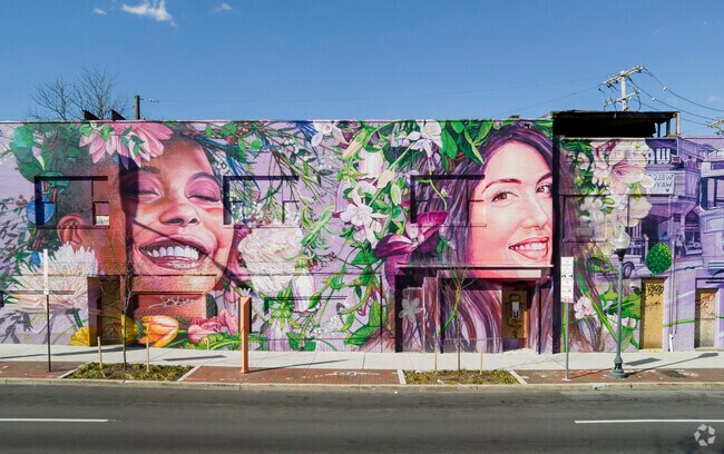 Beautiful large-scale murals can be found throughout the Abell neighborhood.