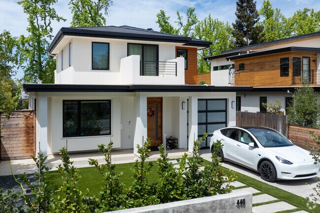 This Modern Minimalist home in Ventura features clean lines, a flat roof, and sleek finishes with an open-air balcony and solar roof.