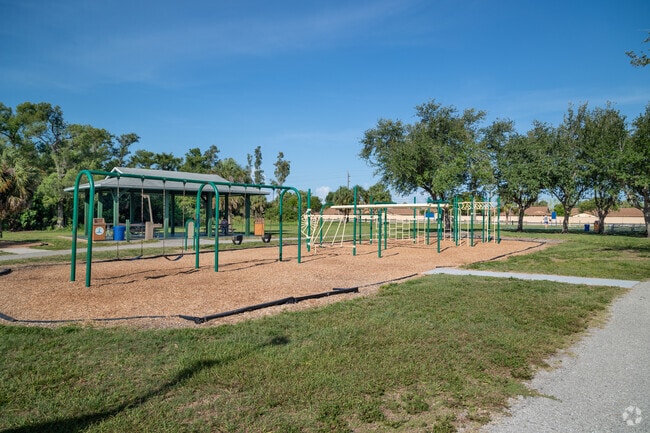Hunter Park in Pine Manor features a large playground with jungle gyms and a swing set for kids.