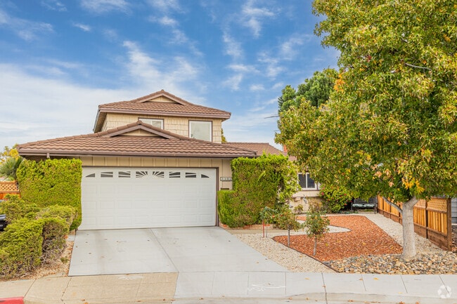 A shingle split level with clay tile for a roof in Los Prados, San Mateo.