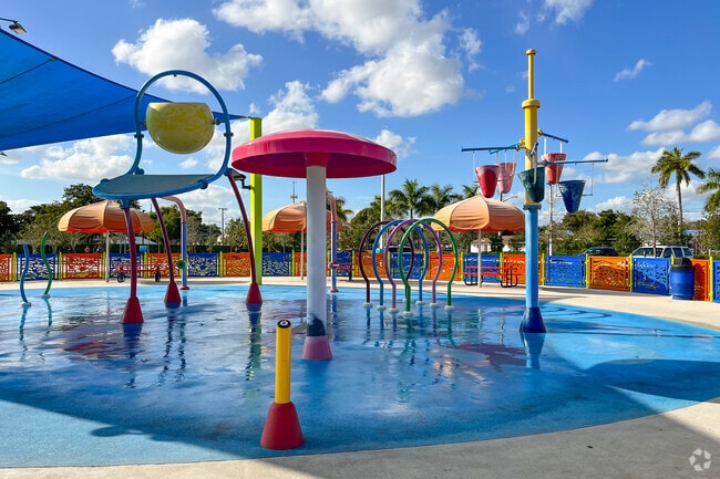 The water splash zone for kids at Waters Edge Park in The Mainlands of Tamarac Lakes is perfect for summer fun.