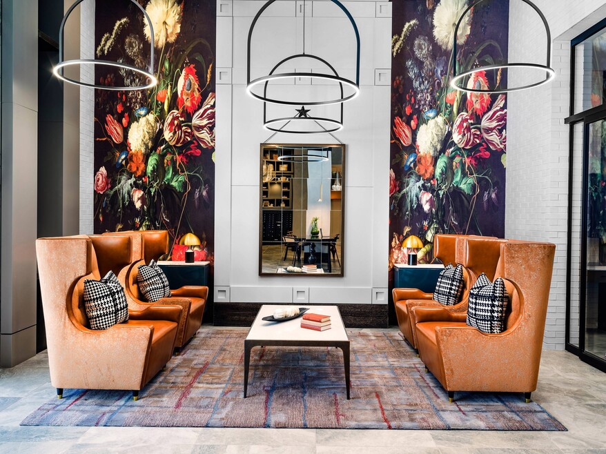 Lobby with large chairs and mirror