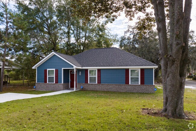 Single story new construction in Feiler Park features colorful shutters.