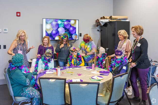 Saint James residents join clubs and meet friends to celebrate fun events like a Mardi Gras party.