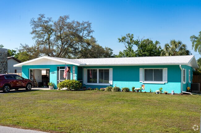 Pops of colorful homes compliment the bright blue sky in Edgewood.