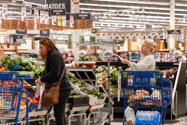 Providence residents shop for fresh produce at the local Meijer.