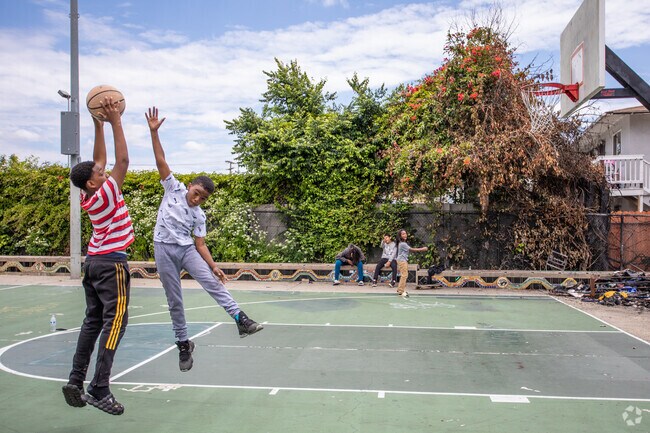 The basketball courts in Cesar Chavez Park are frequently getting used by aspiring young kids.